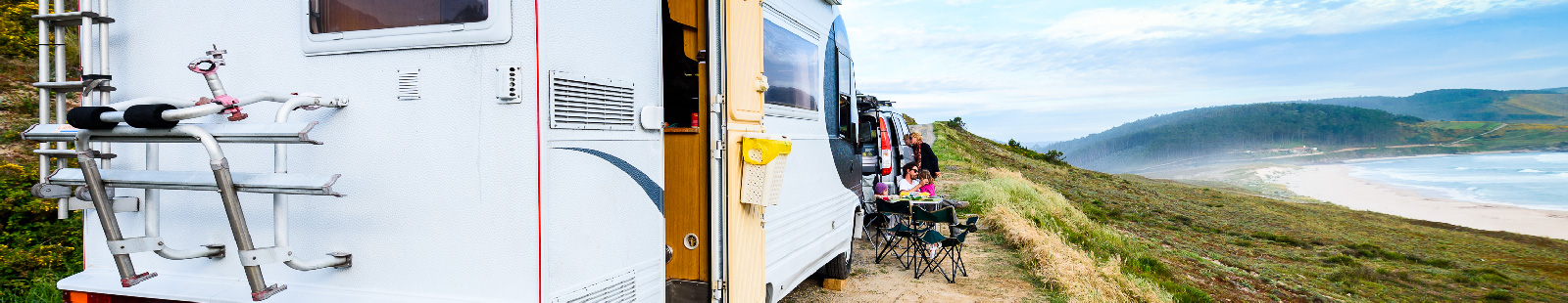 Image of an RV by the water