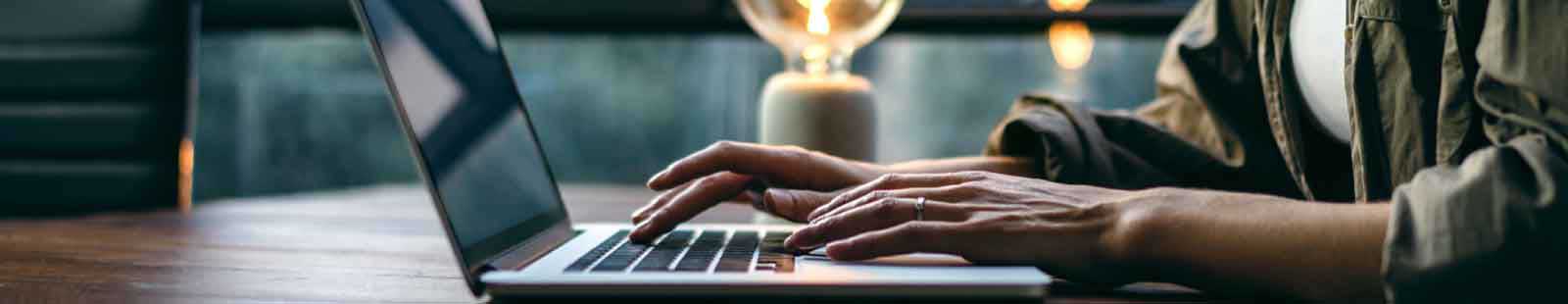 person typing on computer