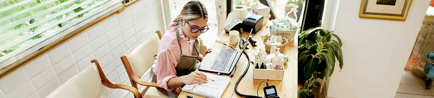 Image of woman working on her small business.